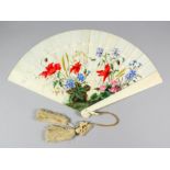 A late 19th/early 20th Century ivory fan, the sticks painted with wild flowers and grasses, and with