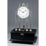 An Edwardian nickel plated and ebonised battery powered electric mantel timepiece by Ever Ready, the