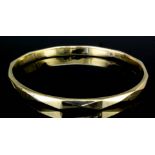 A 9ct gold stiff bangle with faceted face (gross weight 11.5 grammes)