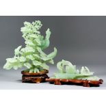 Two pieces of 20th Century green jadeite, one carved with a larger exotic bird and two other smaller