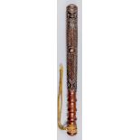 A 19th/ 20th Century Pacific Islands wooden truncheon, the body chip carved with beaked creatures,