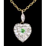 A 9ct gold mounted diamond and peridot heart shaped pendant, the face set with central peridot (