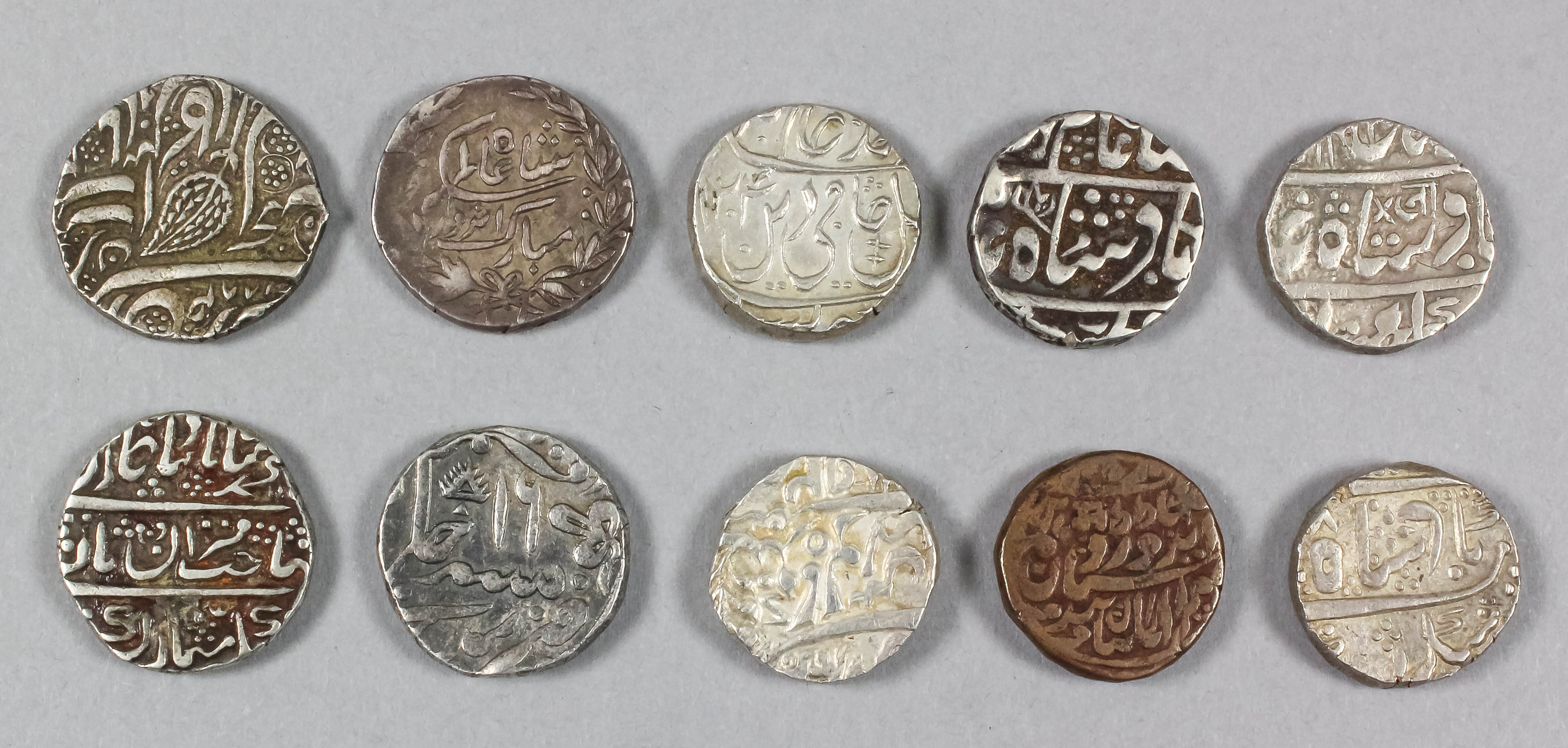 A collection of ten Indian silver rupees (Jaisalmir, Jaipur, Indore, Jat, Jodhpur, Kishangar and