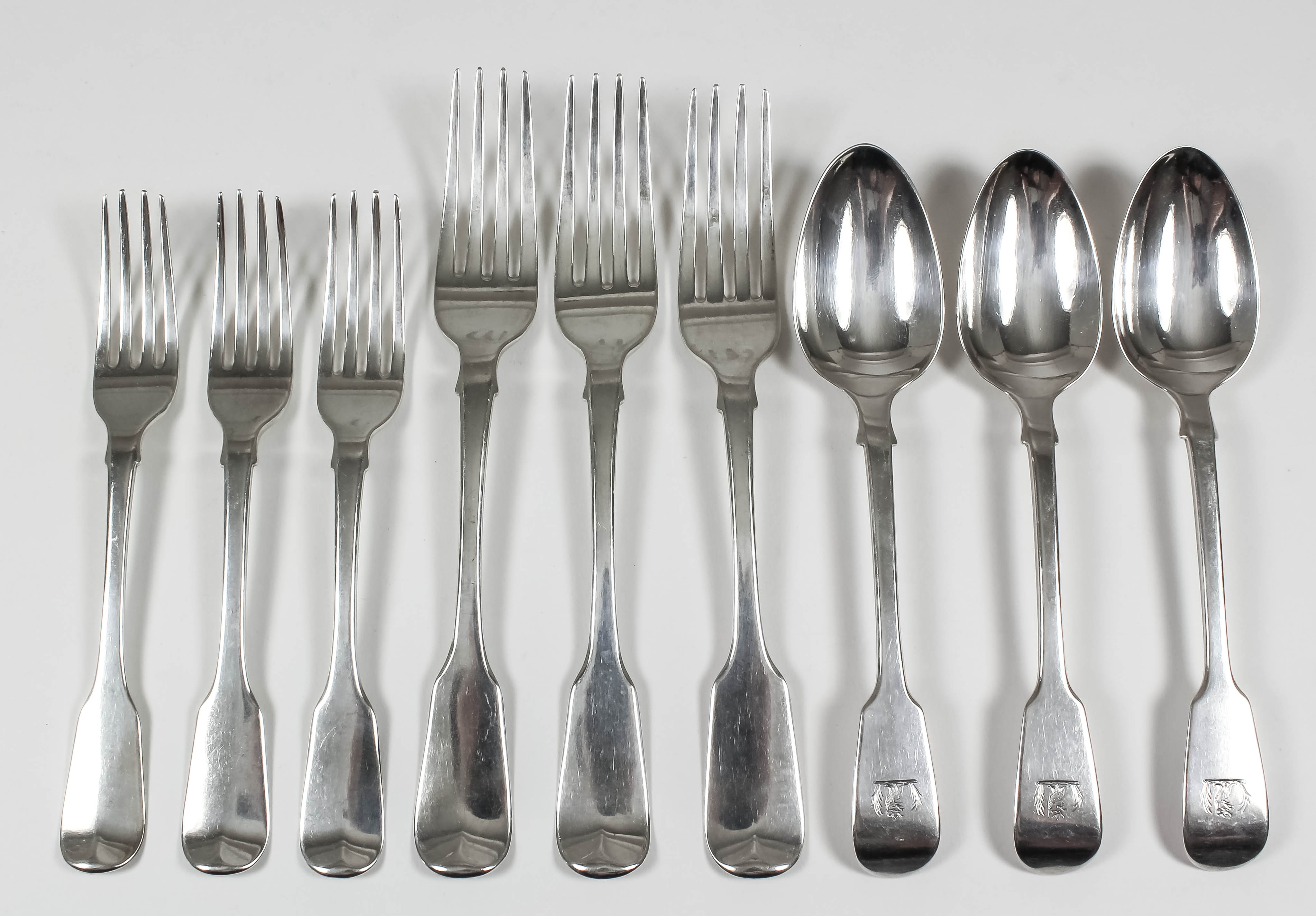 Eight George IV silver fiddle pattern table forks, by William M. Traies, London 1824, nine