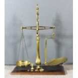 A set of brass scales by W. & T. Avery Ltd, class B to weigh 4lbs, with turned finial, scroll