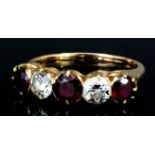 A gold coloured metal mounted ruby and diamond five stone ring, set with three rubies (each