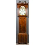 An early 19th Century oak longcase clock, the 13ins arched painted dial with Roman numerals,