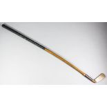 A Bussey & Co, London, golf club "Thistle", brass putter with patent steel socket, hickory shaft and