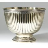 A 20th Century Italian silver gilt circular rose bowl with moulded rim and reeded body, on moulded