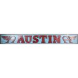 A 1950's red and sky blue painted rectangular advertising sign "Austin" cars with raised letters