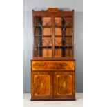 A late 19th Century mahogany secretaire bookcase of "George III" design, the whole inlaid in