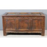A late 17th Century panelled oak coffer with moulded rails and three panels to top and front, the