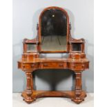 A Victorian "Duchess" mahogany dressing table with arched top central mirror, flanked by open