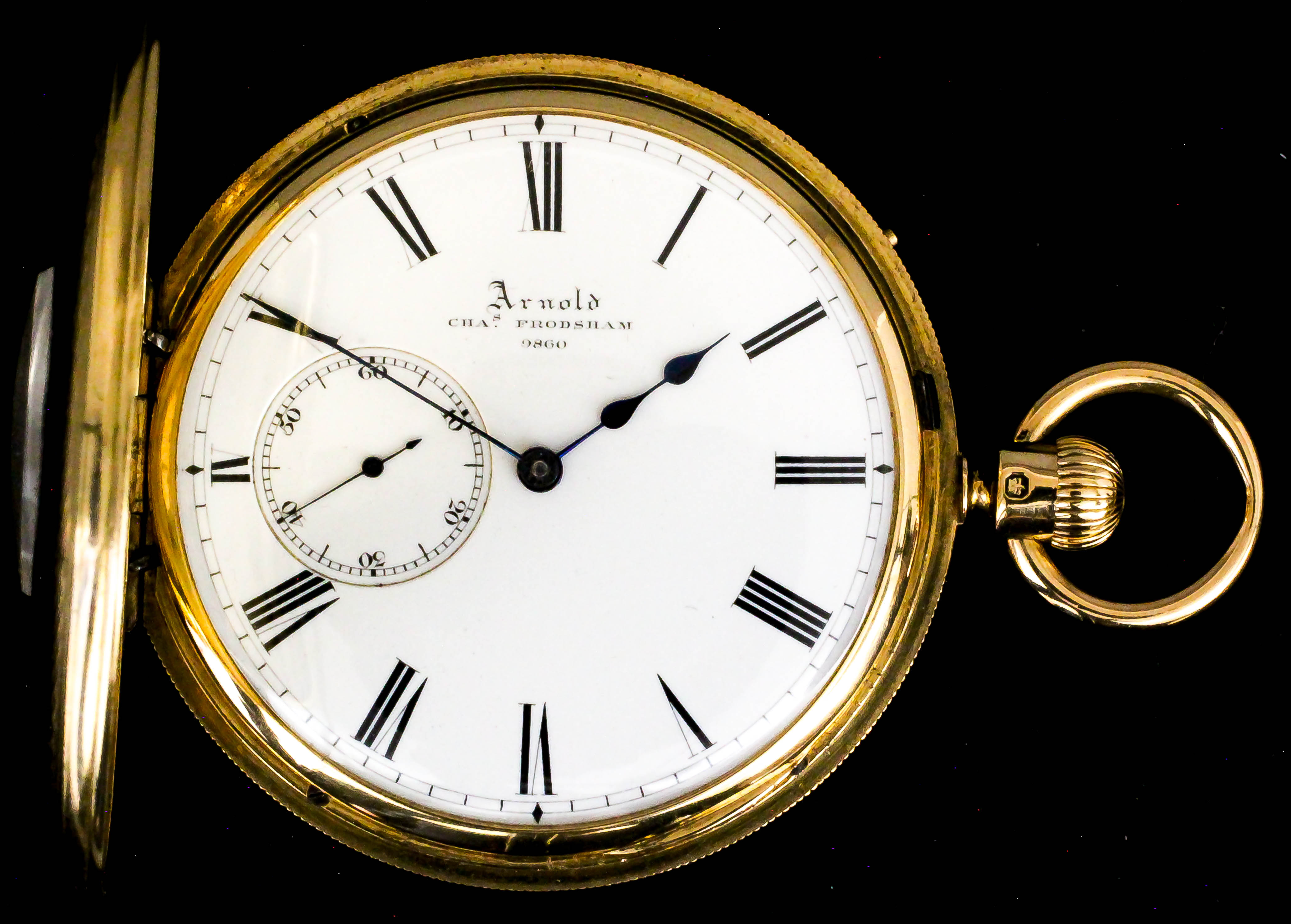 A Victorian 18ct gold half hunting cased keyless pocket watch made by Adolph Nicole for Arnold &