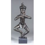 A modern dark brown patinated metal standing figure of Shiva (?), 19.75ins, on ebonised wood base