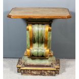 A green painted and gilt scroll pattern capital with walnut octagonal top, on plinth base with re-