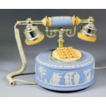 A modern Wedgwood blue jasperware telephone, the circular drum sprigged with classical figures,