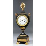 A 19th Century French bronzed and gilt brass urn pattern mantel clock, the 3.5ins diameter white