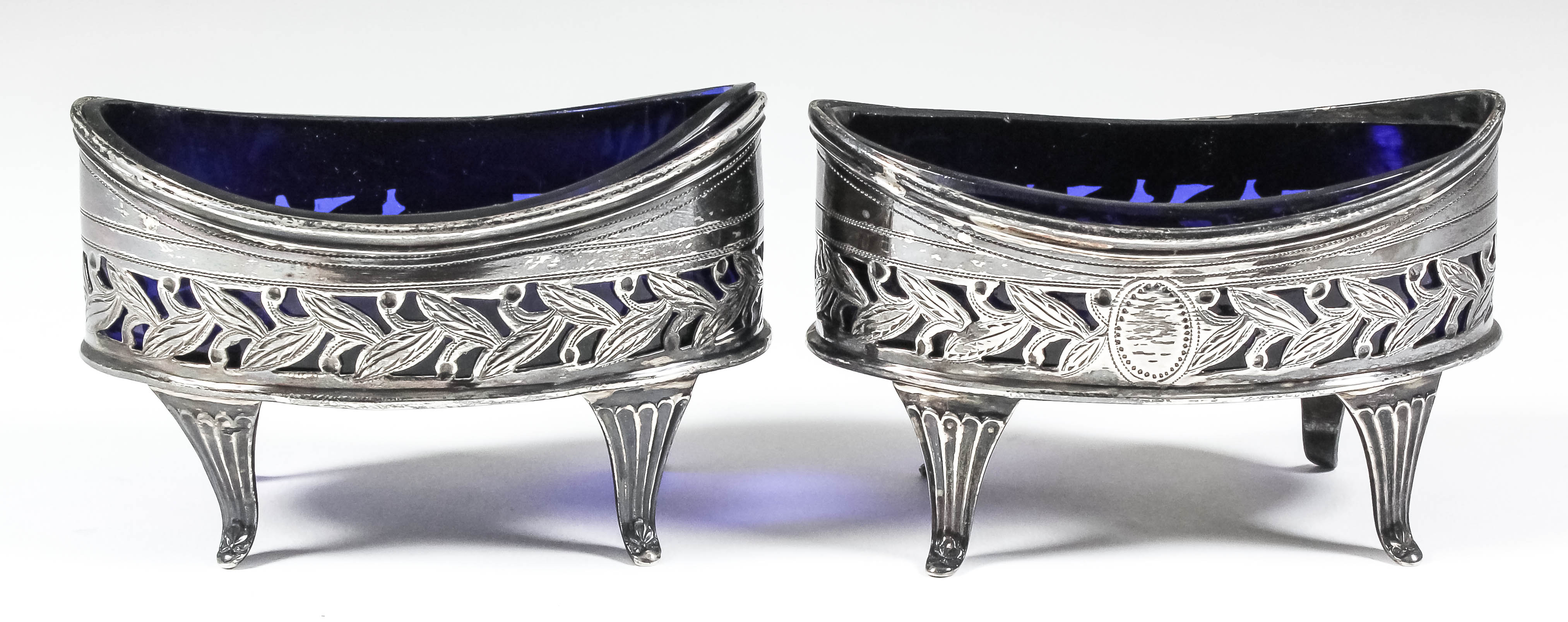 A pair of George III silver ovoid salts of Neo-Classical design with moulded rims, pierced and