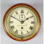 An early 20th Century brass bulkhead cased wall clock retailed by Lilley & Reynolds Ltd, London, the