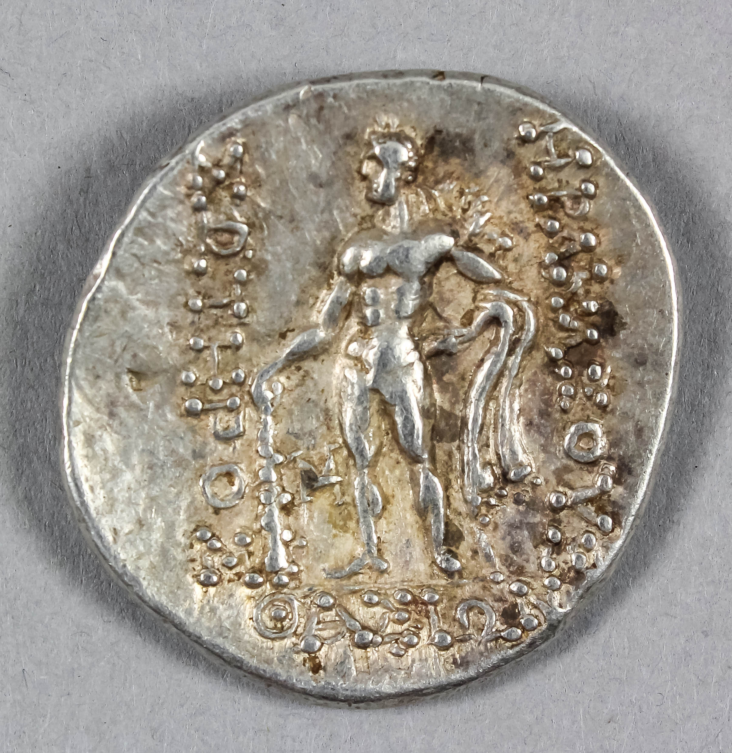 A Greek (Thrace) silver tetradrachm (411-350 B.C.) with the head of Dionysos, 32mm diameter (