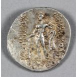 A Greek (Thrace) silver tetradrachm (411-350 B.C.) with the head of Dionysos, 32mm diameter (