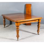 A Victorian mahogany extending dining table with rounded corners and moulded edges, three extra