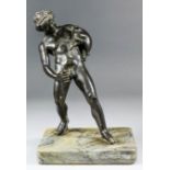 19th Century Italian school - A bronze standing figure of a satyr with a wineskin after the