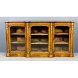 A Victorian burr walnut and gilt metal mounted breakfront credenza, the front inlaid with stringings