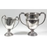 "Challenge Cup" - A George VI silver two-handled cup with reeded rim and flying scroll handles, on