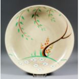 A Clarice Cliff pottery dish painted with "Dryday" pattern with a mushroom glaze, 10.25ins