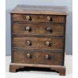 A George III mahogany night commode with moulded edge to top, fitted two long drawers and one deep