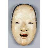 A Japanese carved wood Noh mask of Zo-Onna, decorated in coloured pigment over gesso, 8.5ins (21.