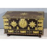 An African (Zanzibar) hardwood and brass mounted chest, the whole with pierced and engraved mounts