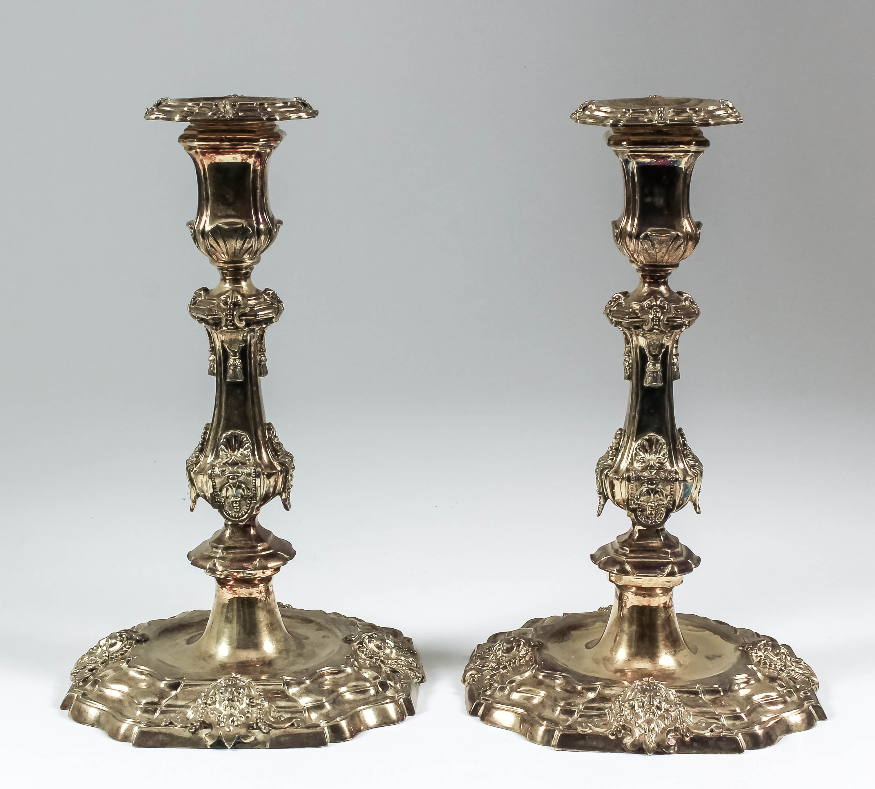 Two silver gilt pillar candlesticks of "early 18th Century" French design, with square moulded