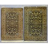 Two modern Isphahan silk rugs woven in old gold and pale blue with central lozenge shaped medallions