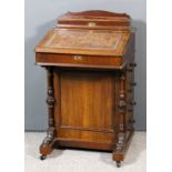 A Victorian mahogany Davenport, the superstructure with lidded stationery compartment, the leather