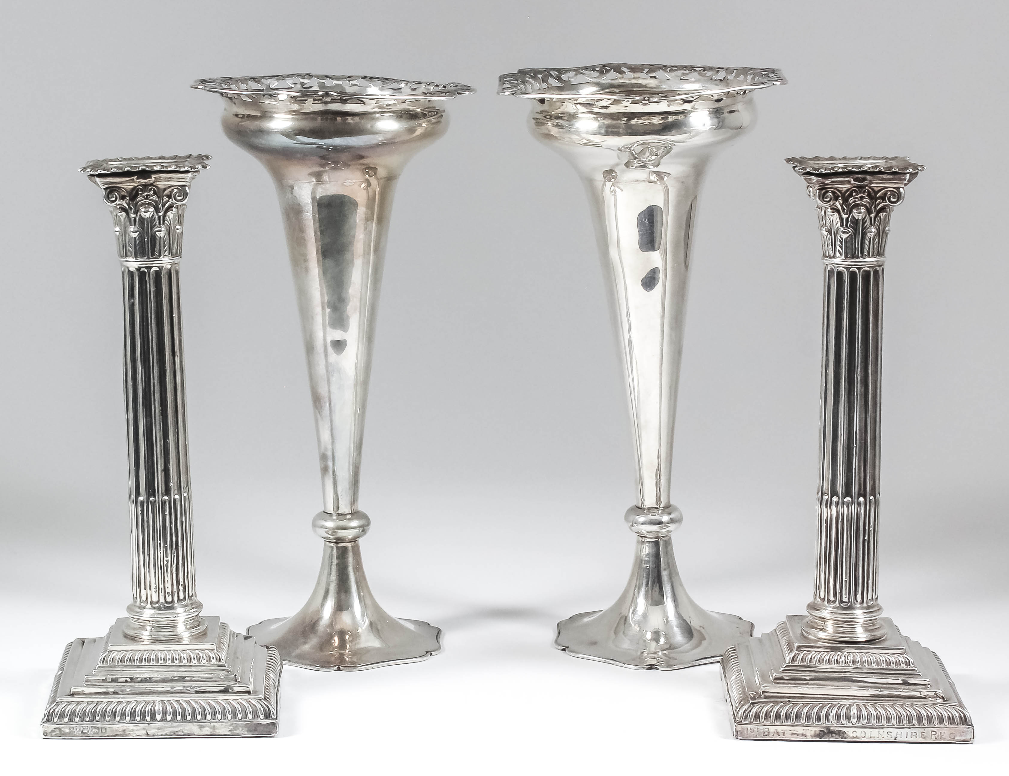 A pair of late Victorian silver pillar candlesticks, the stopped fluted columns with Corinthian