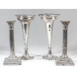 A pair of late Victorian silver pillar candlesticks, the stopped fluted columns with Corinthian