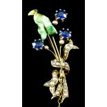An 18ct gold mounted sapphire, seed pearl and enamel floral bouquet pattern brooch, set with three