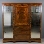 An early 20th Century mahogany grained as rosewood wardrobe with moulded cornice and bead