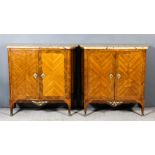 A pair of early 20th Century French kingwood side cabinets of slight serpentine outline with breccia