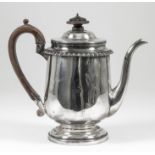 A George IV silver gravy Argyle with slightly domed cover, gadroon mounts, wooden finial and C-