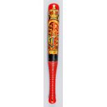 A Victorian turned wood truncheon, painted with crown and "VR" over royal arms within garter, on a