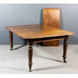 A Victorian mahogany extending dining table with four extra leaves, rounded corners and moulded edge