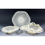A Belleek porcelain basket with handle, the rim applied with moulded flowers and leaves, 11ins x