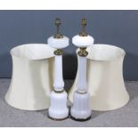 Two 19th Century opaque white glass oil lamps with octagonal bulbous columns and faceted bases,