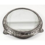 A Victorian silver circular plateau inset with mirror plate, the moulded border with four plain