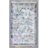 A modern Chinese silk picture rug woven in pastel shades with views of pavilions on a lake, within