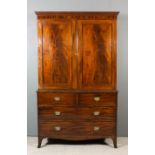 A George III gentleman's mahogany wardrobe, the upper part with moulded and dentil cornice, now